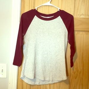 Maroon and tan baseball tee.